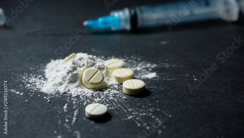 Foto drugs with a disposable syringe. Misused concept of drugs.