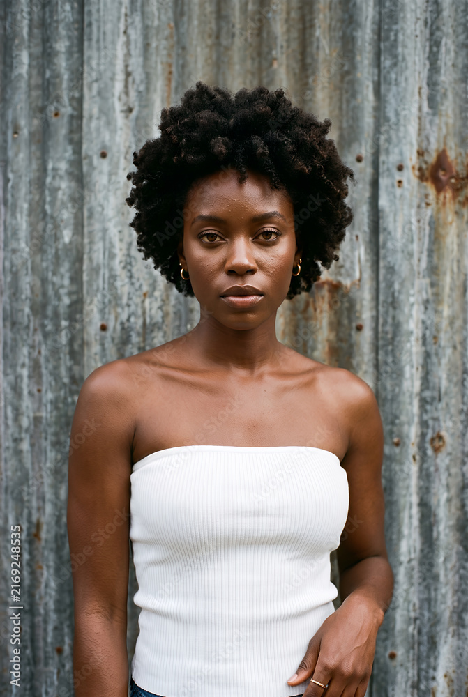 Fototapeta premium Woman with natural afro hairstyle in studio portrait session