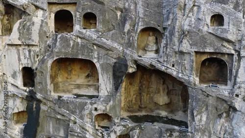 Ancient Buddhist rock‑cut statues, Longmen Grottoes, traces of iconoclasm and cultural looting in Chinese history