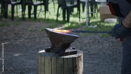 Blacksmith Forging Hot Steel With Hammer