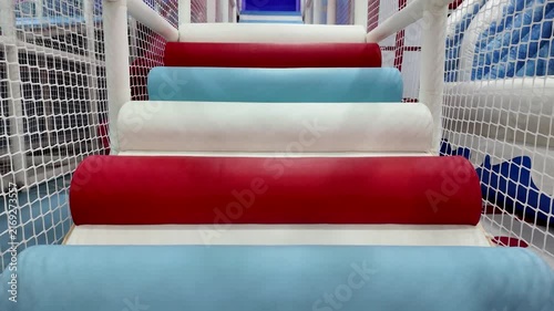 Colorful Padded Soft Play Stairs Inside an Indoor Children Playground and Adventure Center.