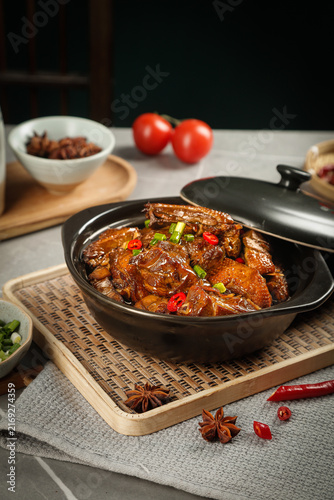 Braised Goose Stew in Traditional Iron Pot - Rustic Farmhouse Kitchen Cooking Scene