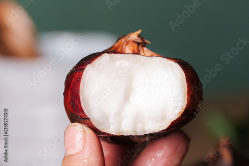 Fresh Mangosteen Tropical Fruit Cut Open Showing White Flesh Inside Red Purple Rind