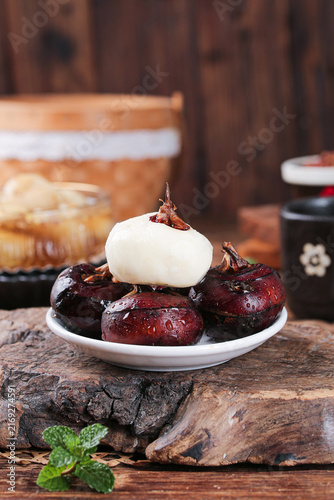 Grilled Red Plums with Ice Cream Rustic Farmhouse Dessert on Wood Table
