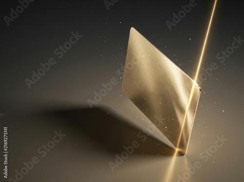Close-up of golden credit card chip reflecting light during secure contactless payment transaction
