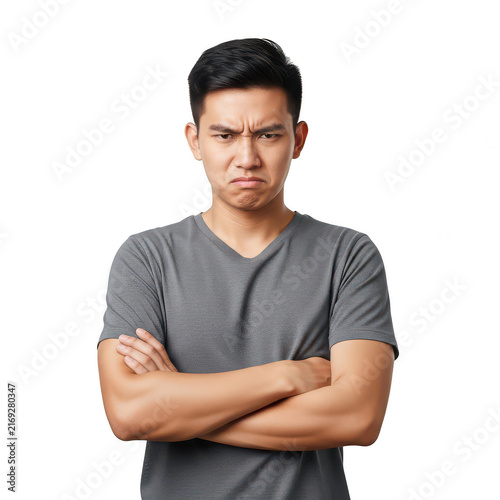 Young man with arms crossed looking angry and frustrated isolated on transparent background