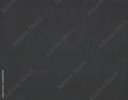 Black primed canvas texture. Blank woven fabric surface background. Perfect for painting mockups, dark digital art overlays, or elegant graphic design backgrounds.