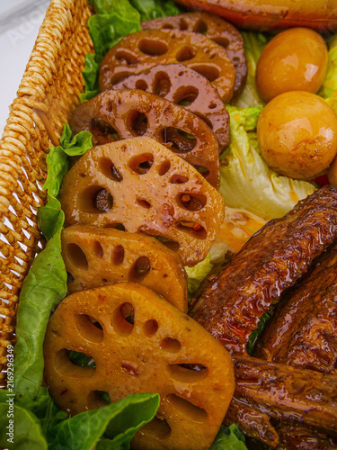 Cuadro en lienzo Marinated Pork Ribs with Lotus Root and Eggs in Traditional Bamboo Basket - Asia