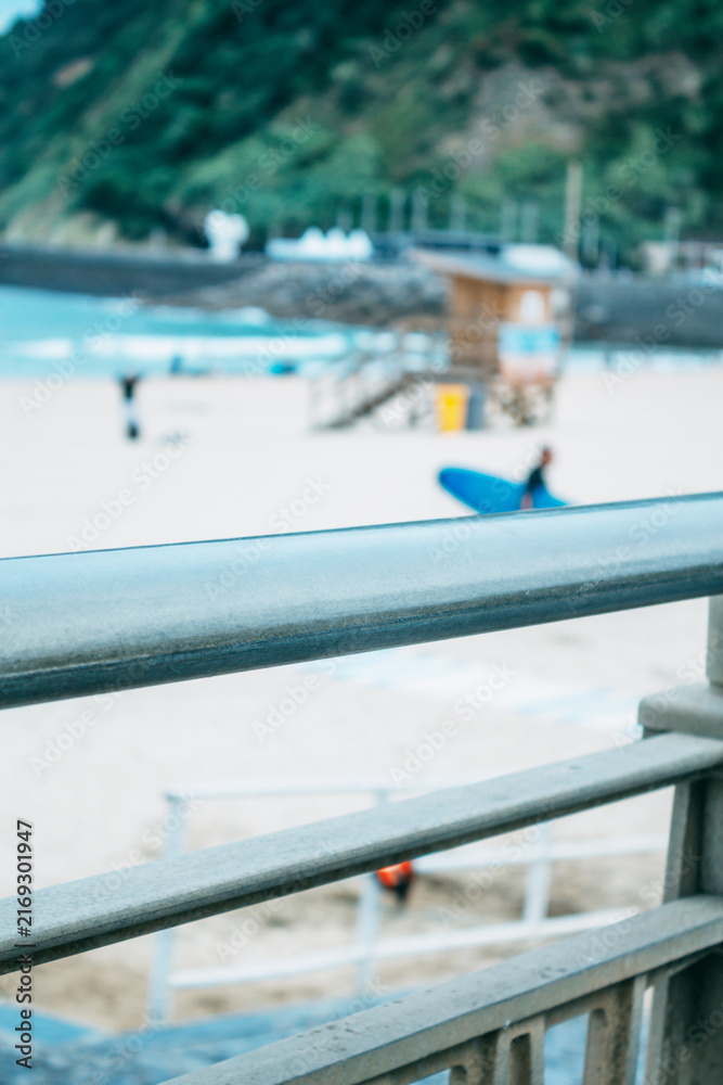 Fototapeta premium Zurriola beach in Donosti or San Sebastian with surfers in the background