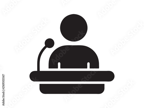Foto Public speaker icon at podium with microphone, black silhouette of orator giving