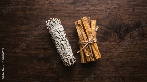 White sage smudge sticks cinnamon dark wood table