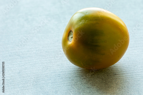 Canvastavla One Green Grape Cherry tomato on a light background