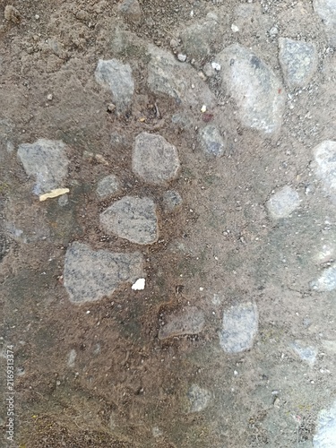 Cuadro en lienzo fA texture of an old, weathered concrete floor mixed with rough stones, pebbles, and coarse sand