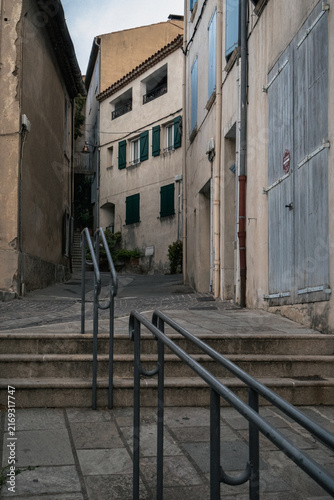 Принти на полотні Narrow historic street with traditional shutters in southern France