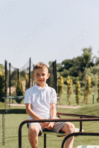 Happy Boy Playing on Modern Playground