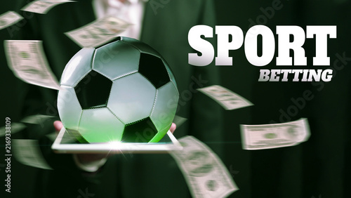 Canvas Print Sport betting with soccer ball and cash in a hand at a betting venue