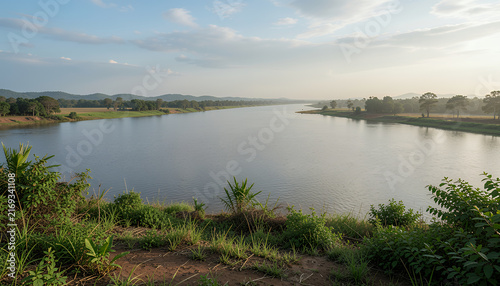 River landscape with calm water and green foreground