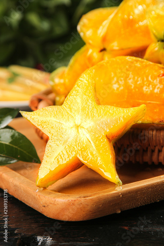 Konstfotografi Fresh Yellow Star Fruit Carambola from Hainan China on Wooden Board - Tropical E