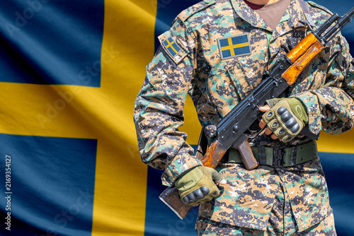 Fotografía Sweden flag with soldier holding assault rifle