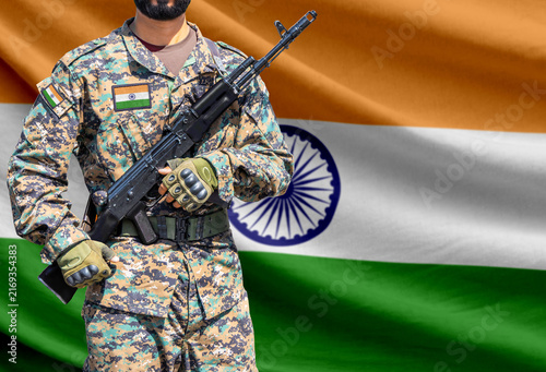 India flag with soldier holding assault rifle