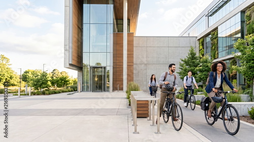 Professional woman commuting to work by bicycle in an urban environment