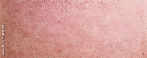 Abstract pastel pink textured background with soft light and subtle patterns