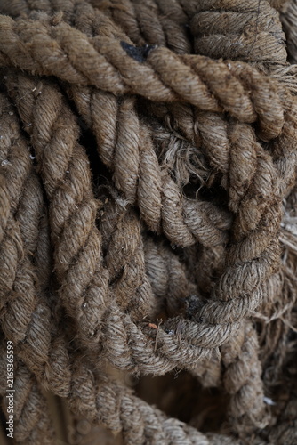 Close up of thick brown nautical rope texture for maritime or industrial background design.