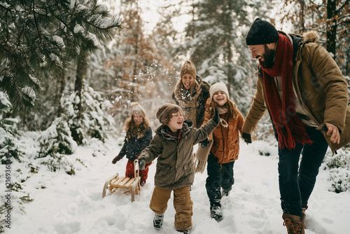 Generative AI - A family spending time together in winter forest