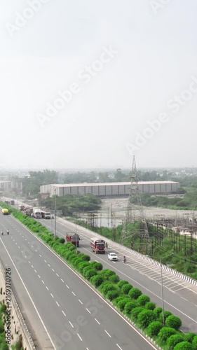 NTPC Thermal Power Plant in Dadri Uttar Pradesh with highway traffic and industrial landscape
