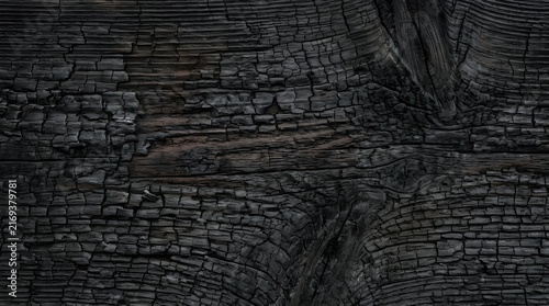Burnt Wood Background Texture with Black Swirling Charcoal Grain