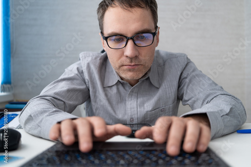 Foto Coding, office and man on computer for programming, system upgrade and software design