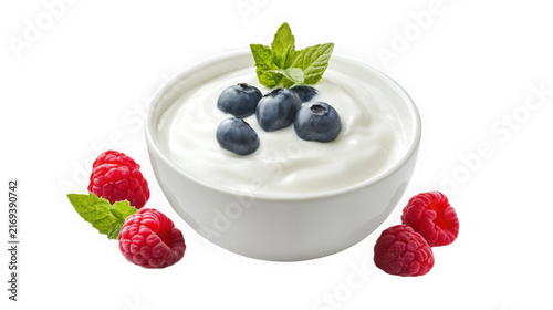 Bowl of creamy white yogurt topped with fresh blueberries with ceramic bowl