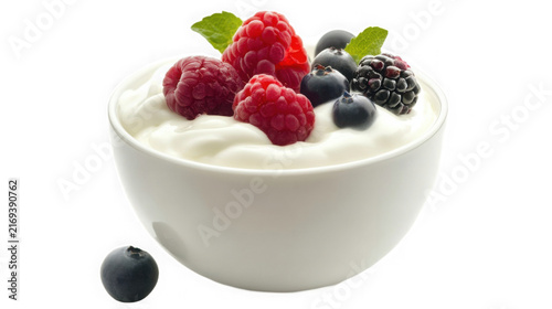 Bowl of creamy yogurt topped with fresh raspberries blueberries with summer