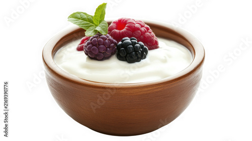 Fresh yogurt in a brown ceramic bowl topped with mixed berries with healthy