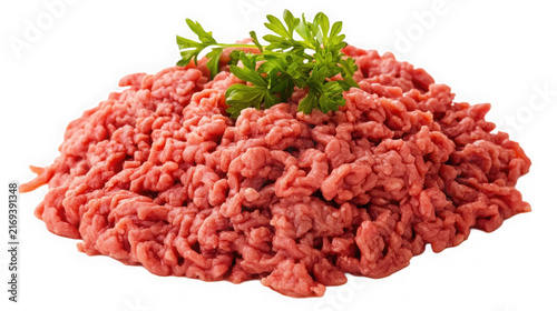 A mound of raw ground beef topped with fresh green parsley with sprig green