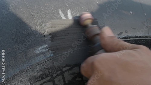 Cold patch tire repair involves applying a textured circular patch over the puncture site using adhesive and a plastic backing to repair a punctured tubeless tire.