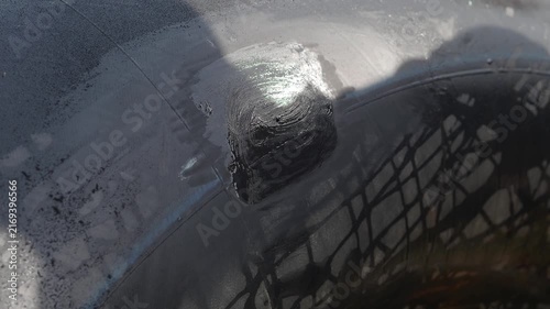Cold patch tire repair involves applying a textured circular patch over the puncture site using adhesive and a plastic backing to repair a punctured tubeless tire.