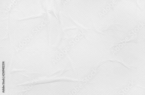 white paper wrinkled poster template ,blank glued ripped creased paper sheet mockup.white poster mockup on wall. empty paper mockup