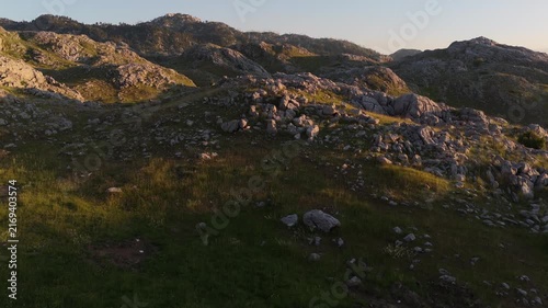 Low Altitude Drone Flight Over Rocky Mountains at Golden Hour