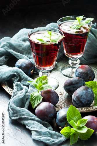 Alcoholic liqueur from plums in shot glasses