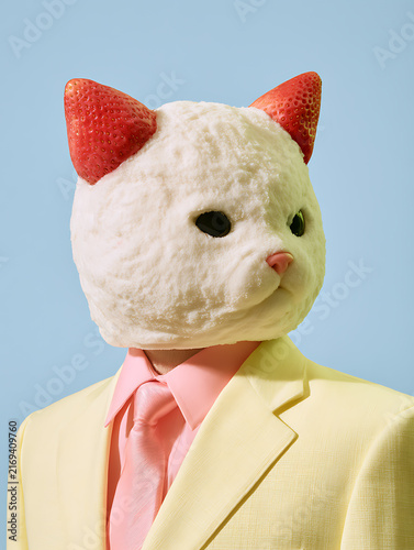 A mannequin in a pastel yellow suit with an adorable cat-shaped head resembling an ice cream cone
