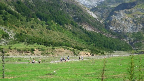 Slow motion, people hiking on the valley.