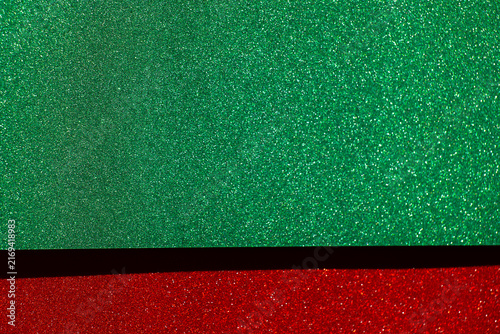  green glitter field with a red sparkling border and copy space for Christmas greetings,website headers, seasonal discounts and retail advertising.Christmas holiday sale