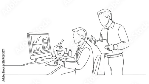 Two scientists working together in a laboratory analysis.