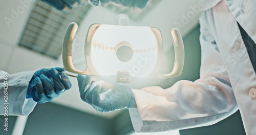 Quadro su tela POV, hands and light with tool for dental procedure, bleeding evaluation or root canal treatment