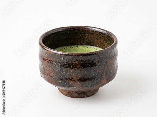Traditional Japanese matcha tea bowl with green tea isolated on white background