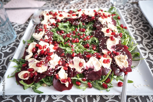 Bild auf Leinwand A vegetarian dish imitating a meat dish: beetroot carpaccio.