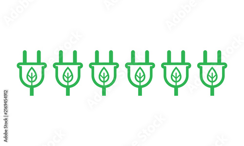 Six green electrical plugs with leaf symbols in a row during a studio shot with a clean concept Isolated on white background
