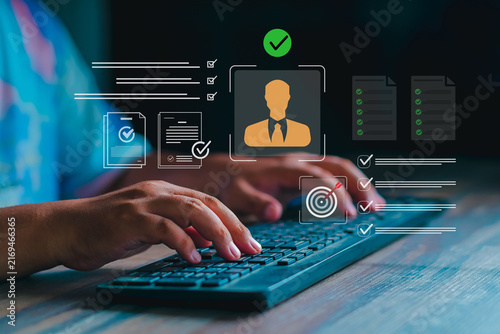 Canvas Print Businessman typing on keyboard with candidate profile, target bullseye, and cert