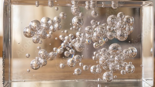 Macro view of spherical air bubbles suspended inside transparent clear resin block